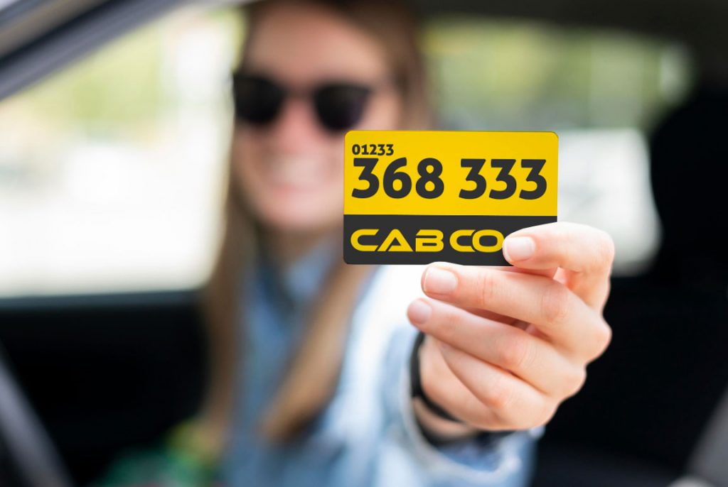 Ashford Taxi Number keep it by a lady in a Car. 24/7 Taxi Number Ashford