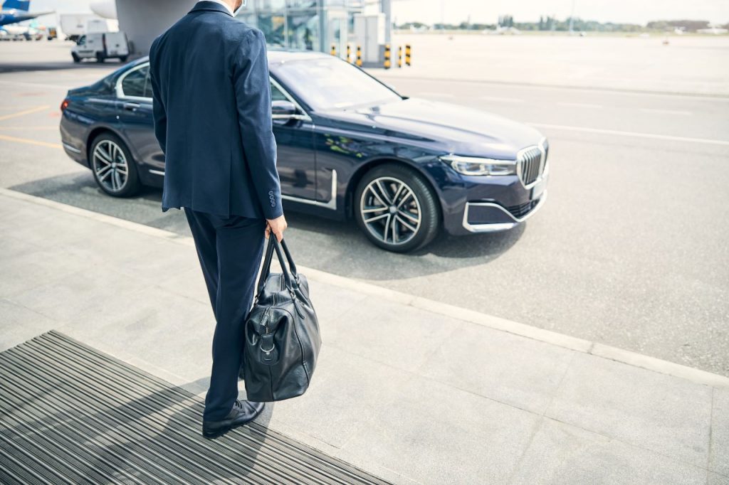 man going to use Airport Taxi Services in Ashford by CabCo